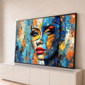 Quadro Decorativo Grande Rosto Laranja para Sala Azul | quadros decorativos para sala | rosto feminino abstrato com textura rachada em azul, laranja e amarelo | Porao dos Quadros