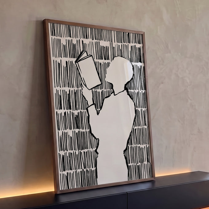 Quadro Decorativo Grande Silhueta Lendo para Sala Preto | quadros decorativos para sala | silhueta bege lendo livro cercada por linhas verticais pretas em estilo gráfico | Porao dos Quadros