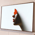 Quadro Decorativo Grande Perfil de Mulher para Sala Laranja | quadros decorativos para sala | perfil feminino em sombra com borboleta laranja pousada no rosto sobre fundo branco | Porao dos Quadros