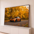 Quadro Decorativo Grande Carro Automóvel Laranja para Sala | quadros decorativos para sala | carro esportivo laranja numa rua de outono cercada por árvores douradas | Porao dos Quadros