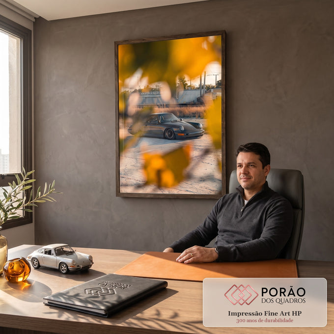 Quadro Decorativo Grande Carro Preto para Sala Cinza | quadros decorativos | carro esportivo cinza escuro visto através de folhas amarelas ao pôr do sol | em ambiente 2 | Porao dos Quadros