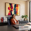 Quadro Decorativo Grande Rostos Geométricos para Sala | quadros decorativos | três rostos geométricos em perfil nas cores vermelho, azul e laranja sobre fundo bege | em ambiente 2 | Porao dos Quadros