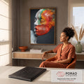 Rosto de mulher de perfil com olhos fechados e pó colorido laranja e verde se dispersando, quadro decorativo