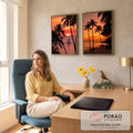 Quadro Decorativo Kit 2 Telas Pôr do Sol para Sala Laranja | quadros decorativos | pôr do sol entre palmeiras com veleiro no mar e praia com canoas | em ambiente 2 | Porao dos Quadros
