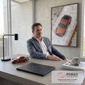 Porsche 911 clássico cor cobre fotografado de cima sobre piso de concreto cinza, quadro decorativo