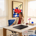 Quadro Decorativo Grande Cerejas Vermelhas para Área Gourmet | quadros decorativos | duas cerejas vermelhas unidas sobre tecido xadrez azul e flor rosa | em ambiente 2 | Porao dos Quadros