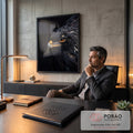 Quadro Decorativo Águia de Olhos Laranja em Fundo Preto | quadros decorativos | close de águia com olho laranja intenso e penas escuras sobre fundo preto | em Quadros para Escritorio | Porao dos Quadros