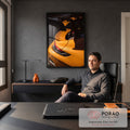 Quadro Decorativo Grande Detalhe de Carro para Sala Laranja | quadros decorativos | detalhe traseiro de carro esportivo laranja com aerofólio preto e lanterna vermelha | em ambiente 2 | Porao dos Quadros