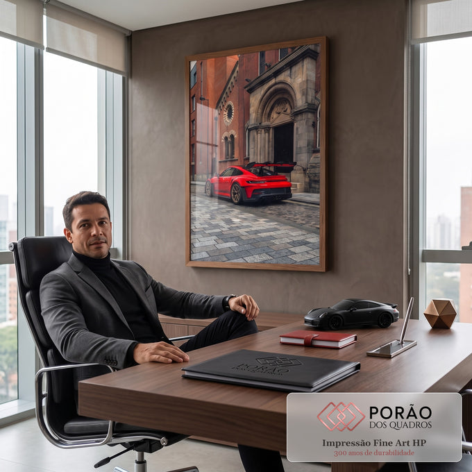 Quadro Decorativo Grande Esportivo para Sala | quadros decorativos | carro esportivo vermelho com aerofólio em rua de paralelepípedos frente a igreja de tijolos | em ambiente 2 | Porao dos Quadros