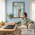 Quadro Decorativo Grande Menino com Maçã para Sala Azul | quadros decorativos | menino equilibrado sobre pilha de livros coloridos segurando uma maçã vermelha | em ambiente 2 | Porao dos Quadros