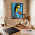 Quadro Decorativo Grande Mulher Pop Art Azul para Sala | quadros decorativos | mulher estilizada com olho grande e flor laranja em fundo azul estilo pop art | em ambiente 2 | Porao dos Quadros