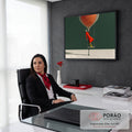 Quadro Decorativo Grande Mulher de Vermelho para Sala | quadros decorativos | mulher de vestido laranja em balanço com balão trançado bege suspenso sobre fundo verde | em ambiente 2 | Porao dos Quadros