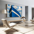 Quadro Decorativo Navegação Tranquila Marítima | quadros decorativos para sala | Proa de barco azul e branco com corrente de âncora contra céu nublado. | Porao dos Quadros