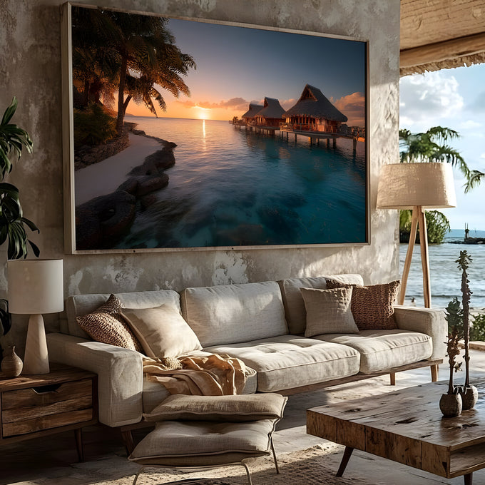 Praia tropical com bangalôs sobre o mar turquesa, palmeiras e pôr do sol dourado, quadro decorativo