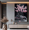 Quadro Decorativo Árvore da Vida com Pétalas Rosas Harmonia e Beleza | quadros decorativos para sala | Árvore com flores rosa vibrantes em ramo preto sobre rochas cinzentas e fundo escuro | Porao dos Quadros