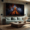 Quadro Decorativo Torre Eiffel Noturna Elegante | quadros decorativos para sala | Torre Eiffel dourada iluminada à noite com árvores em silhueta e céu azul tempestuoso | Porao dos Quadros