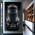 Quadro Decorativo Carro Luxo - Elegância em Preto | quadros decorativos para sala | Bentley preto em vista superior com detalhe dos cromados e luz dramática. | Porao dos Quadros