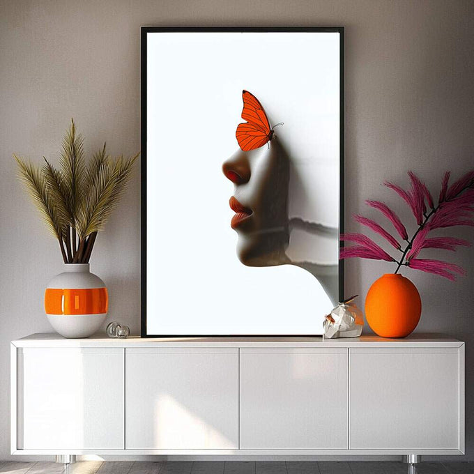 Quadro Decorativo Artística com Borboleta Laranja | quadros decorativos para sala | Perfil feminino em tons neutros com borboleta laranja vibrante sobre a testa em composição artística. | Porao dos Quadros