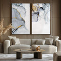 Quadro Decorativo Abstração Mármore e Cores Vibrantes | quadros decorativos para sala | Duas telas abstratas em cinza, branco e dourado com linhas sinuosas e composição minimalista sofisticada | Porao dos Quadros