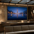 Quadro Decorativo Torre Eiffel Noturna | quadros decorativos para sala | Torre Eiffel iluminada à noite refletida em água azul escuro ao entardecer. | Porao dos Quadros