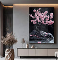 Cerejeira bonsai com flores rosa sobre rochas escuras e fundo preto, quadro decorativo