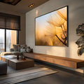 Sementes de dente-de-leão em close com luz dourada do pôr do sol ao fundo, quadro decorativo