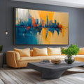 Quadro Decorativo Reflexos Urbanos Inspirador | quadros decorativos para sala | Skyline urbano refletido em água com tons azuis e dourados em composição abstrata | Porao dos Quadros
