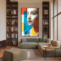 Quadro Decorativo Reflexo Monocromático Vibrante | quadros decorativos para sala | Rosto feminino em cinza com formas geométricas em azul, laranja e amarelo vibrantes em composição moderna. | Porao dos Quadros