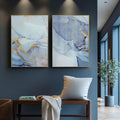Quadro Decorativo Revela Sua Essência: Harmonia Azul e Amarelo | quadros decorativos para sala | Díptico abstrato com tons de azul, roxo e dourado em composição fluida e delicada. | Porao dos Quadros