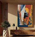 Quadro Decorativo Silhueta da Liberdade | quadros decorativos para sala | Mulher em perfil preto e branco circundada por elementos abstratos em azul, vermelho, amarelo e laranja. | Porao dos Quadros