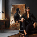Quadro Decorativo Cavalo em Movimento | quadros decorativos para sala | Cavalo preto majestoso em movimento com folhas secas douradas ao redor sob luz quente | em Quadros para Sala | Porao dos Quadros