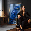 Quadro Decorativo Arara Azul Vibrante | quadros decorativos para sala | Arara azul com olho dourado em galho, fotografia realista de alta qualidade com fundo neutro. | em Quadros para Sala | Porao dos Quadros
