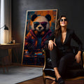 Panda DJ de óculos escuros e fones mixando em controladora, fundo laranja e azul, quadro decorativo