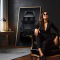 Quadro Esportivo Luxuoso: Estilo e Sofisticação | quadros decorativos para sala | SUV preto luxury visto de frente em fundo cinza escuro com iluminação de estúdio profissional | em Quadros para Sala | Porao dos Quadros