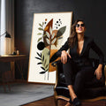 Quadro Decorativo Botânico com Toque Minimalista | quadros decorativos para sala | Composição floral abstrata com folhas em tons bege, marrom e preto formando arranjo vertical sofisticado | em Quadros para Sala | Porao dos Quadros
