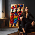 Quadro Decorativo Feminino Cultura Africana | quadros decorativos para sala | Três mulheres africanas em silhueta com vestes e lanternas vermelhas, azuis e laranja vibrantes. | em Quadros para Sala | Porao dos Quadros