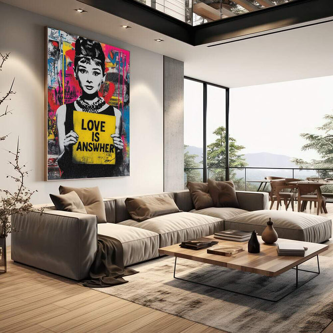 Quadro Decorativo Love é a Resposta | quadros decorativos | Mulher em preto e branco com cartaz amarelo 'Love is Answer' em fundo pop art colorido com magenta, azul e padrões abstratos. | em Quadros para Escritorio | Porao dos Quadros