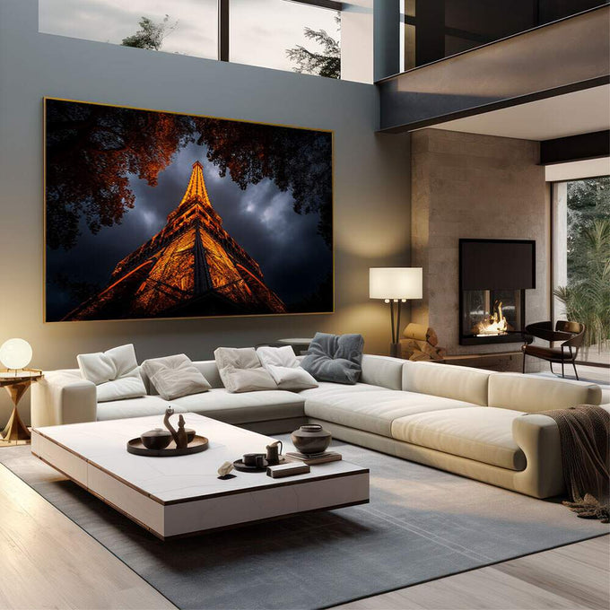 Quadro Decorativo Torre Eiffel Noturna Elegante | quadros decorativos | Torre Eiffel dourada iluminada à noite com árvores em silhueta e céu azul tempestuoso | em Quadros para Escritorio | Porao dos Quadros
