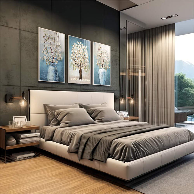 Quadro Decorativo Serenidade Azul Pastel: Flores e Árvores | quadros decorativos premium | Triptco com árvore florida e pétalas brancas em tons azul, creme e branco com movimento e delicadeza. | em ambiente 4 | Porao dos Quadros