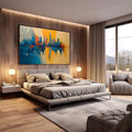 Quadro Decorativo Reflexos Urbanos Inspirador | quadros decorativos premium | Skyline urbano refletido em água com tons azuis e dourados em composição abstrata | em ambiente 4 | Porao dos Quadros