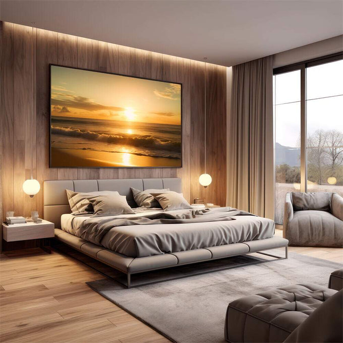 Quadro Decorativo Pôr do Sol com Serenidade | quadros decorativos premium | Pôr do sol dourado na praia com ondas e brilho refletido na areia molhada. | em ambiente 4 | Porao dos Quadros