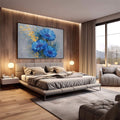 Quadro Decorativo Flores Azuis Elegantes | quadros decorativos premium | Três gerberas azuis vibrantes com efeito de partículas douradas dispersas em fundo cinzento | em ambiente 4 | Porao dos Quadros
