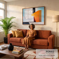 Quadro Decorativo Grande Formas Geometrico para Sala Laranja | quadros decorativos para sala de estar | blocos geométricos laranja, branco e preto formando estrutura abstrata sobre céu azul | em ambiente 3 | Porao dos Quadros
