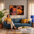 Quadro Decorativo Kit 2 Telas Pôr do Sol para Sala Laranja | quadros decorativos para sala de estar | pôr do sol entre palmeiras com veleiro no mar e praia com canoas | em ambiente 3 | Porao dos Quadros