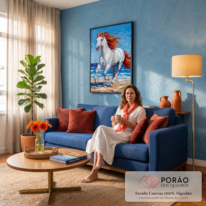 Quadro Decorativo Grande Cavalo Branco para Sala Azul | quadros decorativos para sala de estar | cavalo branco com crina vermelha e laranja galopando na praia sob céu azul | em ambiente 3 | Porao dos Quadros