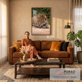 Quadro Decorativo Grande Onça-Pintada Deitada para Sala | quadros decorativos para sala de estar | onça-pintada deitada na areia com olhar fixo e pelagem dourada manchada de preto | em ambiente 3 | Porao dos Quadros