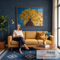 Fotografia de ipê amarelo florido visto de baixo, galhos contra céu azul e sol, quadro decorativo