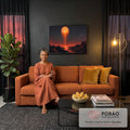 Sol laranja derretendo sobre montanhas negras com lava e rio refletido, quadro decorativo