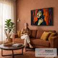 Quadro Decorativo Grande Mulher com Gato para Sala Laranja | quadros decorativos para sala de estar | mulher de olhos fechados segurando gato preto de olhos amarelos, fundo laranja expressivo | em ambiente 3 | Porao dos Quadros