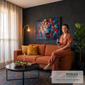 Quadro Decorativo Grande Leão para Sala Preto | quadros decorativos para sala de estar | leão de frente com juba dourada e respingos de tinta colorida sobre fundo preto | em ambiente 3 | Porao dos Quadros